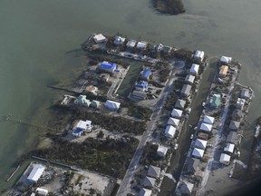 Damaged houses are shown in the aftermath of Hurricane Irma, Monday, Sept. 11, 2017, in the Florida Keys. (Matt McClain/The Washington Post via AP, Pool)