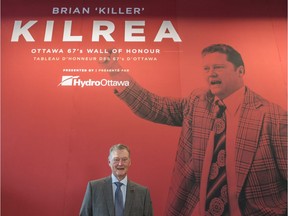 Brian Kilrea stands in front of the Brian Kilrea Legacy Wall at the TD Place arena on Thursday, Sept. 21, 2017.