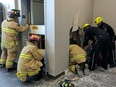 Ottawa firefighters and paramedics worked together on Friday to free a technician trapped underneath an elevator. The fire association wants city council to consider Ottawa for a provincial pilot on "fire-medics."