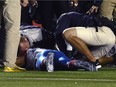 Training staffs attends to Montreal Alouettes' Jonathan Hefney during a game against the Ottawa Redblacks in 2015. Hefney is still suffering the lingering effects of the injury he suffered that night, but his benefits from the CFL have long lapsed.