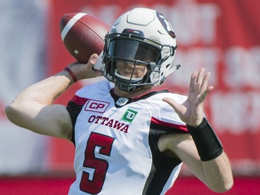 Ottawa Redblacks quarterback Drew Tate throws a pass during first half CFL football action against the Montreal Alouettes in Montreal, Sunday, September 17, 2017.