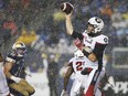 Quarterback Ryan Lindley, making his first start for the Redblacks, throws a pass during Friday's rain-soaked game against the Blue Bombers in Winnipeg. THE CANADIAN PRESS/John Woods