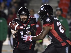 Redblacks tailback William Powell, right, takes a pitch from QB Ryan Lindley in the Sept. 29 game against the Roughriders. Powell rushed for 187 yards in that contest. THE CANADIAN PRESS/Justin Tang