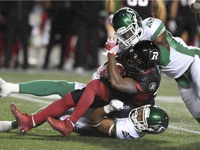 Saskatchewan Roughriders linebacker Jeff Knox Jr. (49) drags down Ottawa Redblacks running back William Powell (29) during second half CFL football action in Ottawa on Friday, Sept. 29, 2017.