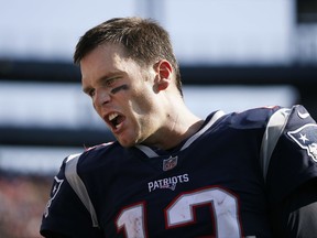 New England Patriots quarterback Tom Brady talks to teammates on the sideline during the second half of an NFL football game against the Houston Texans, Sunday, Sept. 24, 2017, in Foxborough, Mass. (AP Photo/Michael Dwyer)