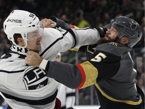 Los Angeles Kings defenseman Kurtis MacDermid, left, fights with Vegas Golden Knights defenseman Deryk Engelland during the first period of an NHL preseason hockey game Tuesday, Sept. 26, 2017, in Las Vegas. (AP Photo/John Locher) ORG XMIT: NVJL111
John Locher, AP