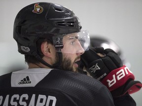 Senators center Derick Brassard watches a drill during practice on Friday. He's restricted from contact during practice until early October after having shoulder surgery in June. THE CANADIAN PRESS/Adrian Wyld