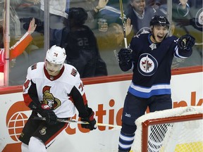 Winnipeg's Marko Dano celebrates scoring the game-winner against Mark Borowiecki and the Ottawa Senators on Wednesday, Sept. 27, 2017. Coach Guy Boucher was not happy with how the Sens played with the puck. 'When you don't manage the puck well, you sabotage yourself and you give your opponent a chance to pressure you, and that's what they did.'