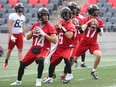 From left, Redblacks quarterbacks Ryan Lindley, Drew Tate, William Arndt and Danny Collins get ready to pass during practice on Wednesday, September 27, 2017.