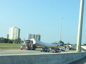 Wind turbine blades being transported along Highway 417 in Ottawa.