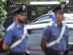 Two Carabinieri (Italian paramilitary police) officers stand by the house of Bruno Gulotta, in Legnano, Italy, Friday, Aug. 18, 2017. Gulotta is one of the 14 victims of Thursday's deadly van attack in Barcelona. (Flavio Lo Scalzo/ANSA via AP) ORG XMIT: LEG101

ITALY OUT
Flavio Lo Scalzo, AP