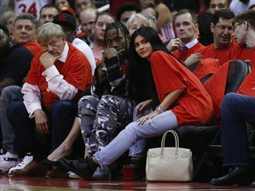 Travis Scott and Kylie Jenner watch courtside during Game Five of the Western Conference Quarterfinals game of the 2017 NBA Playoffs at Toyota Center on April 25, 2017 in Houston, Texas.