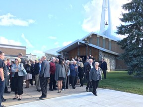 Mourners leave a memorial service held for Sheila Welsh at St. Francis Xavier church in Renfrew on Saturday.