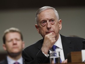 FILE - In this June 13, 2017, file photo, Defense Secretary Jim Mattis listens on Capitol Hill in Washington, while testifying before the Senate Armed Services Committee hearing on the Pentagon's budget. As North Korea flaunts its new nuclear muscle, Defense Secretary Jim Mattis is spotlighting the overwhelming numerical superiority of America's doomsday arsenal. On Wednesday, Sept. 13, he is dropping in on ground zero of American nuclear firepower: Minot Air Force base in North Dakota, home to more than 100 land-based nuclear missiles as well as nuclear bomb-toting aircraft. (AP Photo/Jacquelyn Martin, File)