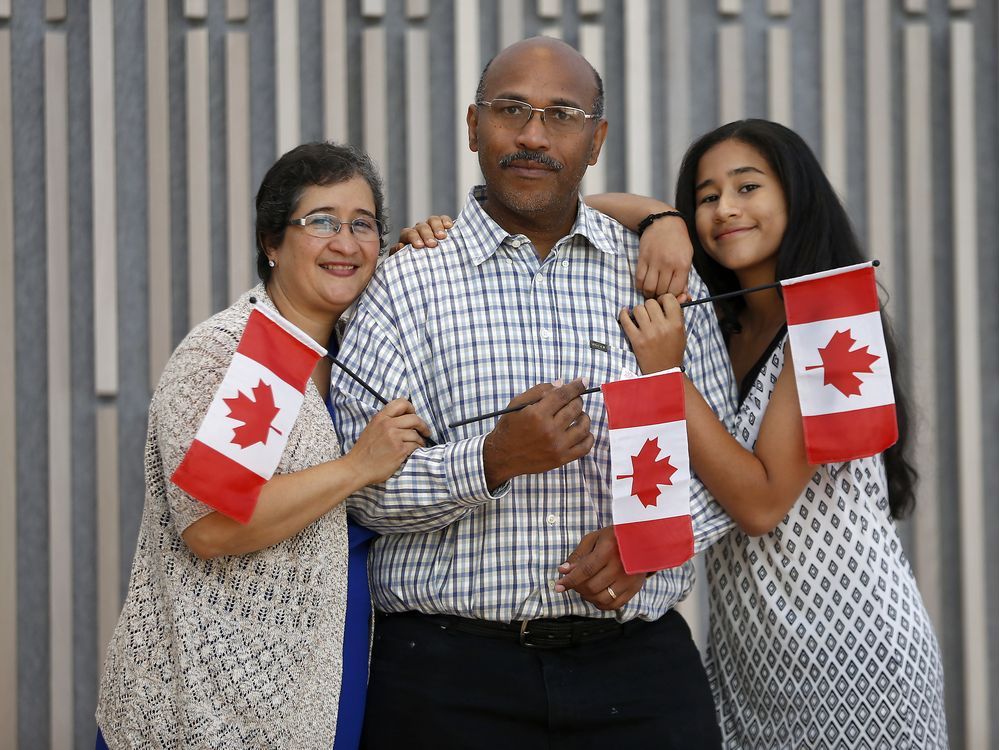 People take part in a Canada Day citizenship ceremony before the