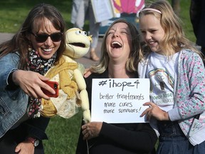 Childhood Cancer Awareness Day

Family, friends and a few politicians gathered at Ottawa City Hall to celebrate Childhood Cancer Awareness Day in Ottawa Ontario Friday Sept 1, 2017. Marion Doull takes a photo of Sarah Argue and Mae Doull before the raising of the Childhood Cancer Awareness Day flag Friday.  Tony Caldwell
Tony Caldwell