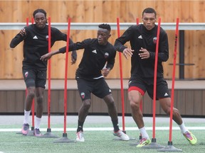 Fury FC players run through a pre-practice drill at TD Place stadium during a workout on Wednesday.   Tony Caldwell/Postmedia