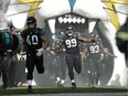 Jaguars defensive tackle Eli Ankou (99) of Ottawa reacts as he and teammates run onto the field before last Sunday's NFL game against the Ravens at Wembley Stadium in London. AP Photo/Matt Dunham