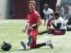 Drew Tate (5) stretches before Redblacks practice on Tuesday. Wayne Cuddington/Postmedia