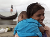 A Rohinga woman cries after the wooden boat she was travelling on from Myanmar crashed into the shore and tipped everyone out on Sept. 12, 2017 in Dakhinpara, Bangladesh.