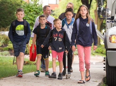 With the first day of school at hand, Jack Mead, Luke Mead, Liam Carnegie, Aiden Carnegie and Hannah Carnegie, under the watchful eye of their dad's, head off to Broadview Public School.
 
Photo Wayne Cuddington/ Postmedia