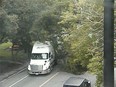 A moving truck apparently snagged a large tree and brought it down, blocking traffic on Laurier Avenue near Bronson Avenue.