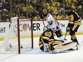 Ottawa Senators center Ryan Dzingel (18) scores a goal against Pittsburgh Penguins goalie Matt Murray (30) during the third period of Game 7 in the NHL hockey Stanley Cup Eastern Conference finals, Thursday, May 25, 2017, in Pittsburgh.