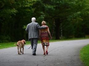 Governor General David Johnston and wife Sharon and dog Rosie leave following a ceremonial tree planting to commemorate the end of his mandate at Rideau Hall in Ottawa on Thursday, Sept. 28, 2017. THE CANADIAN PRESS/Sean Kilpatrick