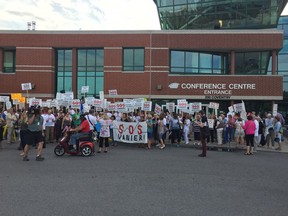 Members of the SOS Vanier group rally outside a public consultation at 200 Conventry Rd. about Salvation Army's planned move from its ByWard Market location to Montreal Road.