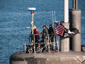 PUGET SOUND, Wash. (Sept. 11, 2017) Cmdr. Melvin Smith, commanding officer of the Seawolf-class fast-attack submarine USS Jimmy Carter (SSN 23), looks on as the submarine transits the Hood Canal on its way home to Naval Base Kitsap-Bangor. Jimmy Carter is the last and most advanced of the Seawolf-class attack submarines, which are all homeported at Naval Base Kitsap. (U.S. Navy photo by Lt. Cmdr. Michael Smith/Released)