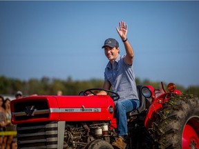 Justin Trudeau drives a tractor at the International Plowing Match in Walton, Ont. recently. But the Liberals' proposed tax changes aren't exactly friendly to the family farm.