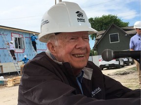 Former U.S. president Jimmy Carter takes a break from building Friday, July 14, 2017, in Winnipeg on last day of Habitat for Humanity project.