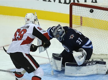 Ottawa Senators forward Alex Formenton beats Winnipeg Jets goaltender Connor Hellebuyck on a breakaway.
