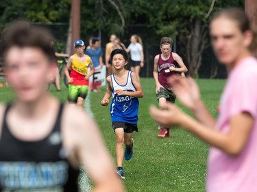 Midget Boy competitors sprint to the finish as the 2017 Gryphon Open Cross Country Meet takes place Wednesday at the Terry Fox Athletic Facility .