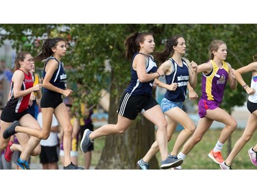 The junior girls jostle for position as they head towards the climb up the Mooney's Bay hill as the 2017 Gryphon Open Cross Country Meet takes place Wednesday at the Terry Fox Athletic Facility.