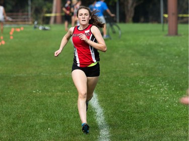 Junior girl competitor Sophie Levasseur from the L'école élémentaire et secondaire publique L'Équinoxe Patriotes arrives to finish in first place at the 2017 Gryphon Open Cross Country Meet takes place Wednesday at the Terry Fox Athletic Facility.