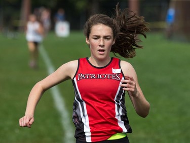 Junior girl competitor Sophie Levasseur from the L'école élémentaire et secondaire publique L'Équinoxe Patriotes arrives to finish in first place at the 2017 Gryphon Open Cross Country Meet.