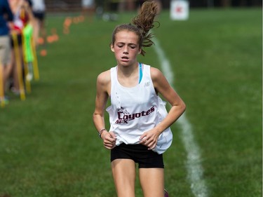 Junior girl competitor Skye Pellerin from the SFX Coyotes, arrives to finish in second place as the 2017 Gryphon Open Cross Country Meet takes place Wednesday at the Terry Fox Athletic Facility near Mooney's Bay featuring competitors from area schools. The event is hosted by the Glebe Collegiate Gryphons.  Photo Wayne Cuddington/ Postmedia
Wayne Cuddington, Postmedia