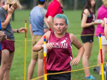 Julia Sanderson, a junior girl competitor from South Carleton High, arrives to finish in fifth place as the 2017 Gryphon Open Cross Country Meet .