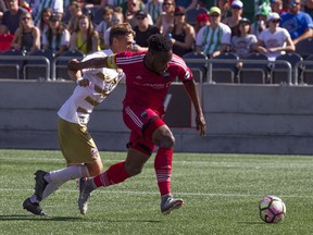 Fury FC defender Eddie Edward gets the ball away from a Louisville City FC during a game on Sept. 24.   Ashley Fraser/Postmedia