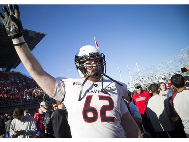 Carleton Ravens #62 KC Bakker celebrates after they won the Panda Game against the uOttawa Gee-Gees at TD Place Saturday September 30, 2017.