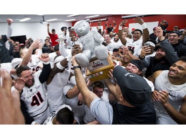 Carleton Ravens head coach Steve Sumarah handed Pedro over to the team after they won the Panda Game against the uOttawa Gee-Gees at TD Place Saturday September 30, 2017.