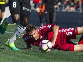 Fury FC's Nick DuPuy can only watch as Battery's Neveal Hackshaw gets possession of the ball on this occasion during Sunday's match at TD Place stadium.   Ashley Fraser/Postmedia
