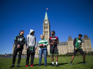 The Saskatchewan Roughriders held a practice on Parliament Hill Sunday October 1, 2017 in Ottawa, after playing the Redblacks Friday night. Roughriders fan Donna Kitchen was practicing her head tilt jubilation dance with some of the players.   Ashley Fraser/Postmedia