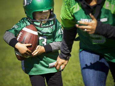 The Saskatchewan Roughriders held a practice on Parliament Hill Sunday October 1, 2017 in Ottawa, after playing the Redblacks Friday night. Four-year-old Declan Dingle who was born in Saskatchewan but lives in Gatineau, was all smiles having a fun game on the side of the grass with his mom.   Ashley Fraser/Postmedia