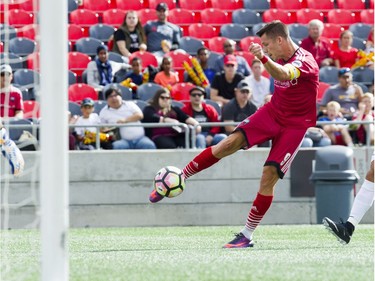 Fury FC's Carl Haworth strikes the ball for his second goal against FC Cincinnati on Sunday.   Ashley Fraser/Postmedia
