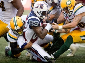Montreal Alouettes wide receiver TJ Graham is tackled during CFL action against the Edmonton Eskimos in Montreal on Monday October 9, 2017.