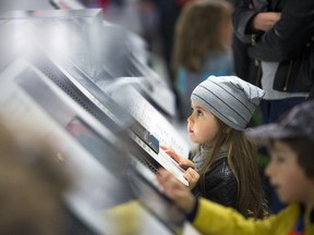 Three and half year old Aura Fortier was captivated by the displays Saturday morning at the Canadian Museum of Nature open house.