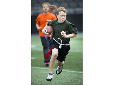 12-year-old Kent Moors gets the ball down the field during a round robin game at TD Place Sunday October 15, 2017.