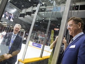 Former 67's coach Brian Kilrea took part in a pre-game event honouring past players, including Bobby Smith (right), on Friday night.   Ashley Fraser/Postmedia